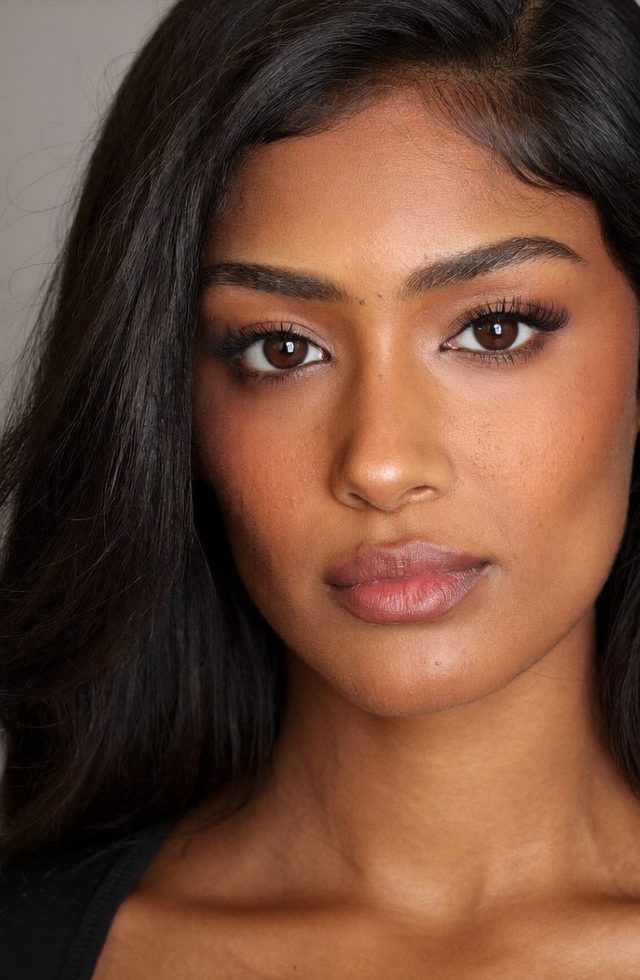 AI model headshot — south asian, black top